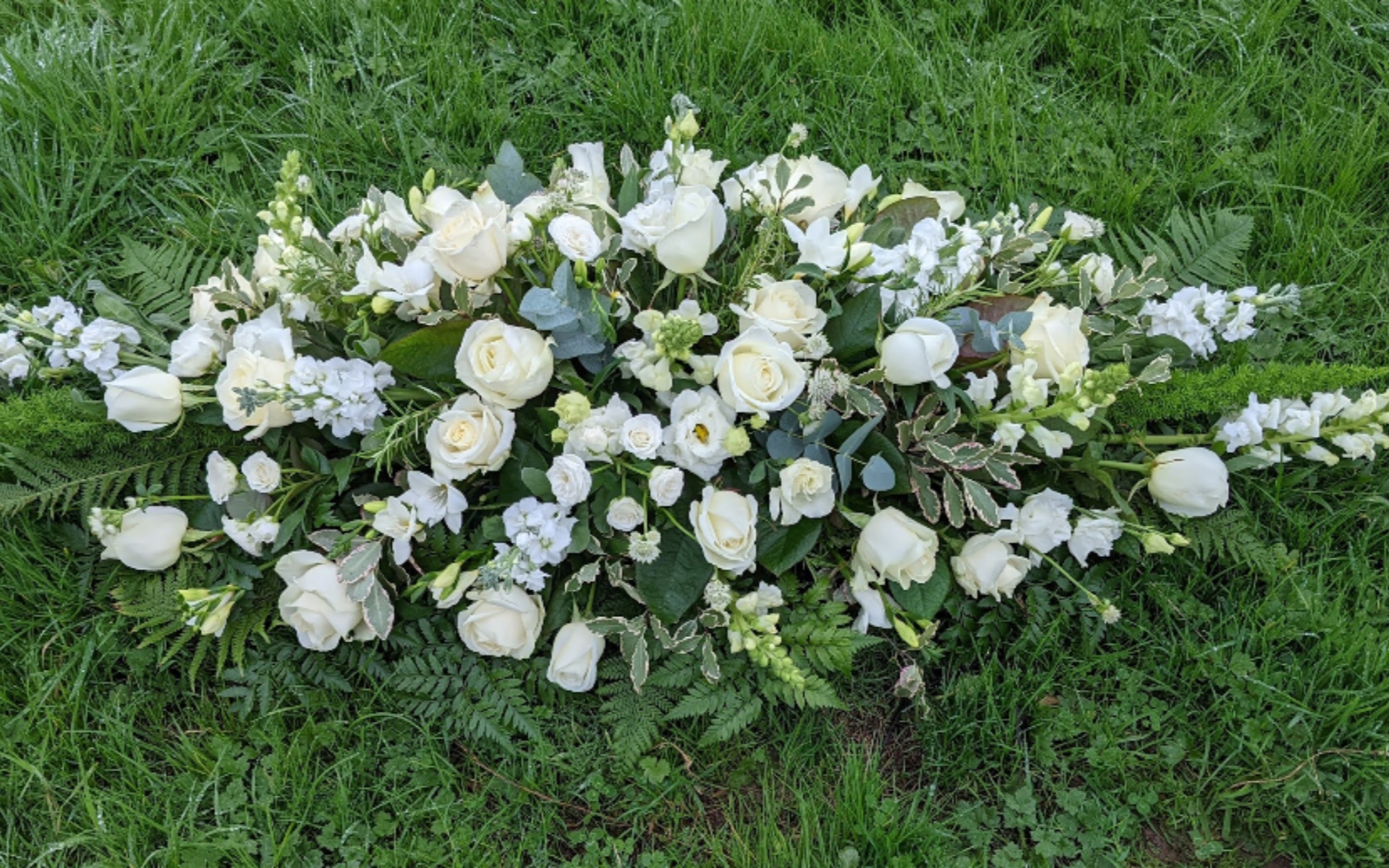 flora fauna funeral flower arrangement 1