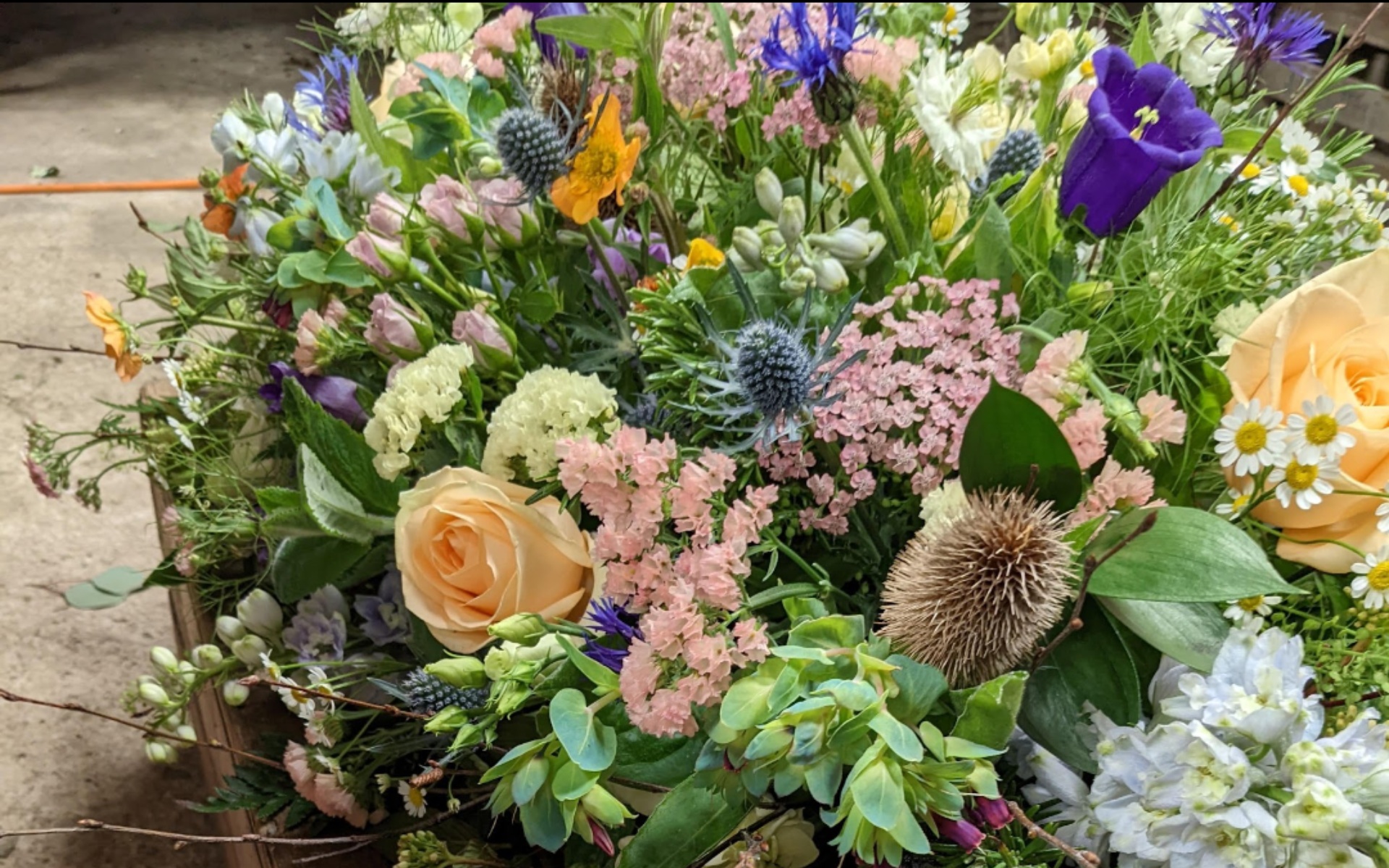 flora fauna funeral flower arrangement 2